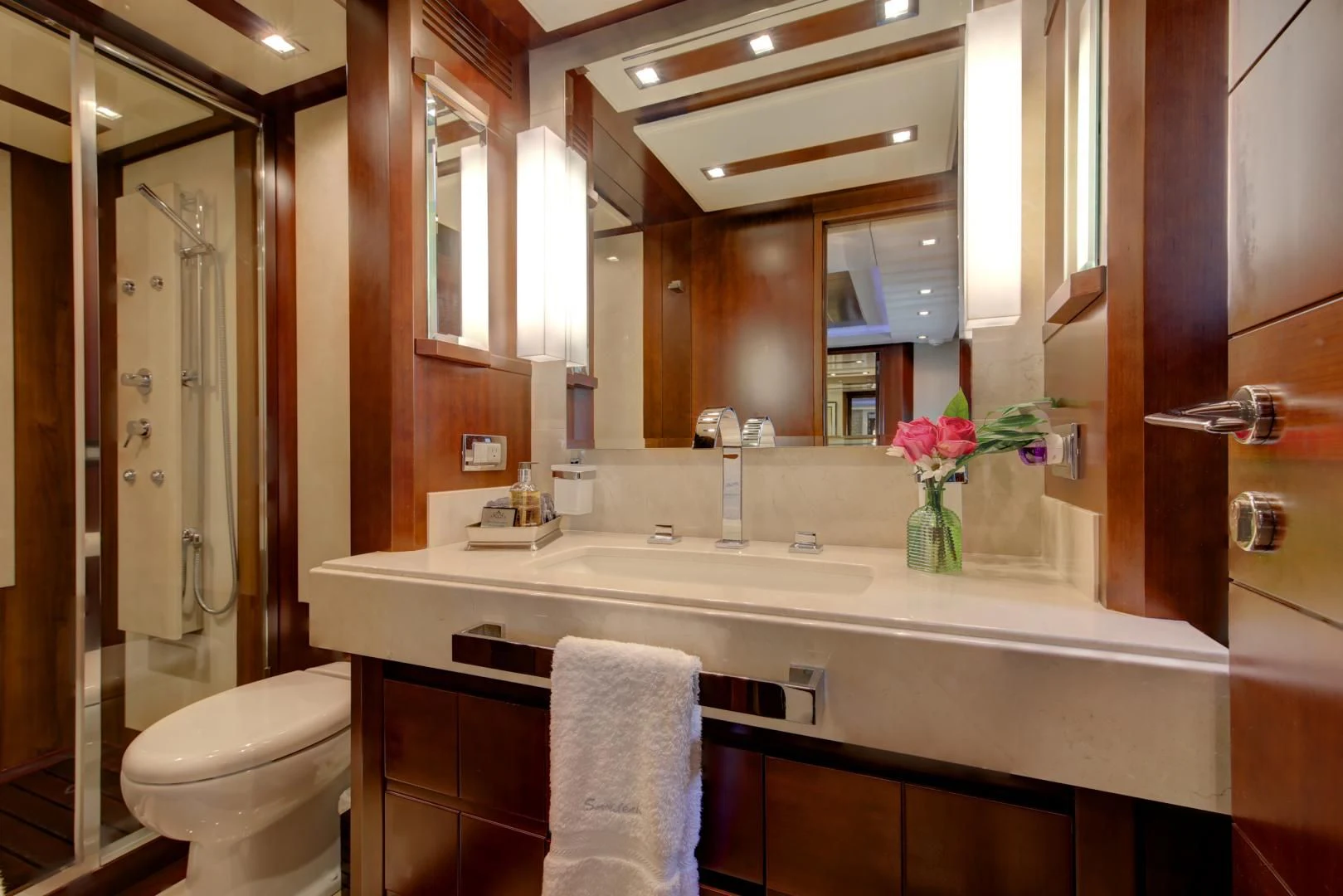 a bathroom with a large mirror aboard SORRIDENTE Yacht for Sale