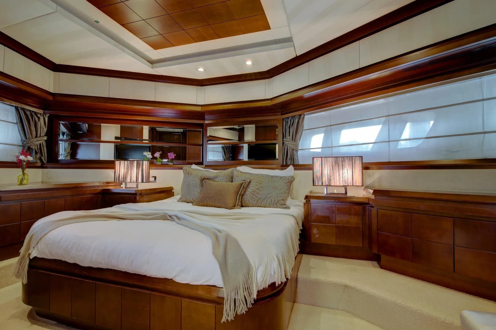 a room with a bed and a window aboard SORRIDENTE Yacht for Sale