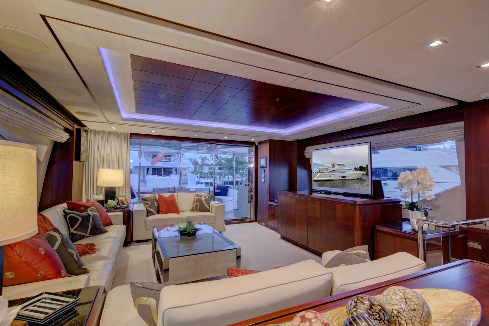 a living room with a large window aboard SORRIDENTE Yacht for Sale