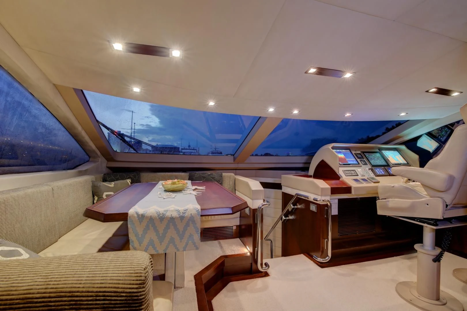 a room with a table and chairs aboard SORRIDENTE Yacht for Sale