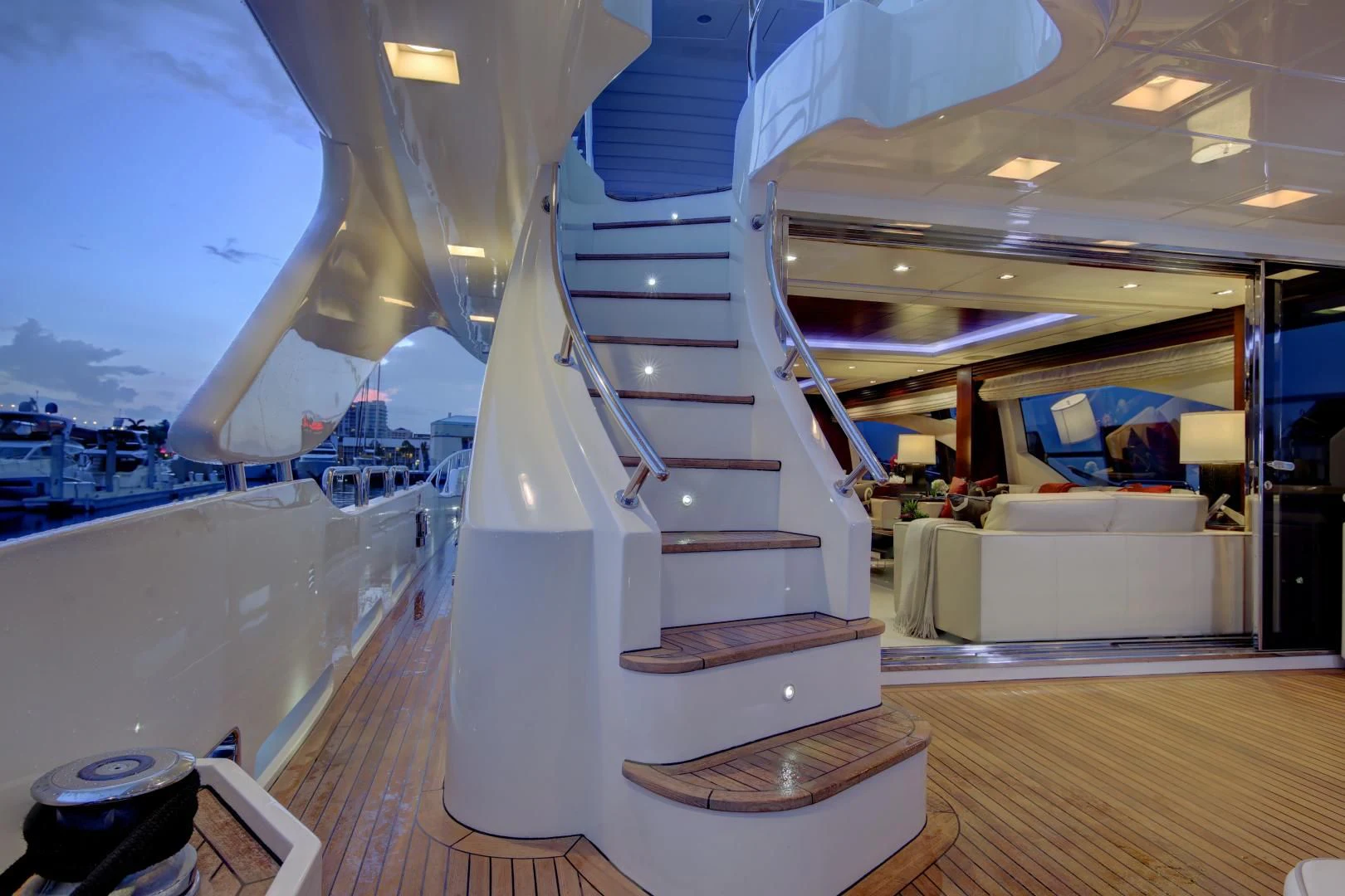 a staircase with a railing and a view of a city aboard SORRIDENTE Yacht for Sale