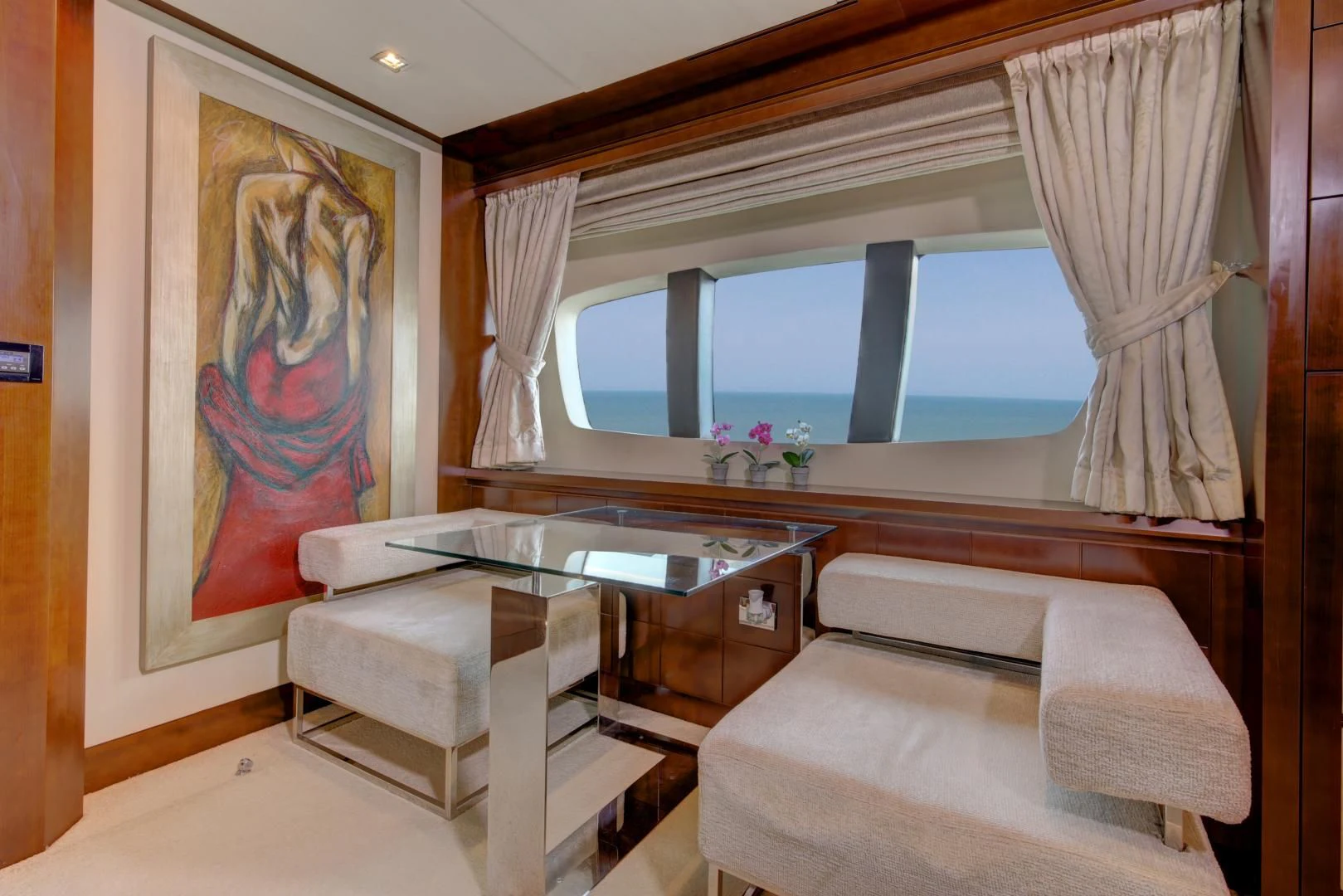 a room with a couch and a table aboard SORRIDENTE Yacht for Sale