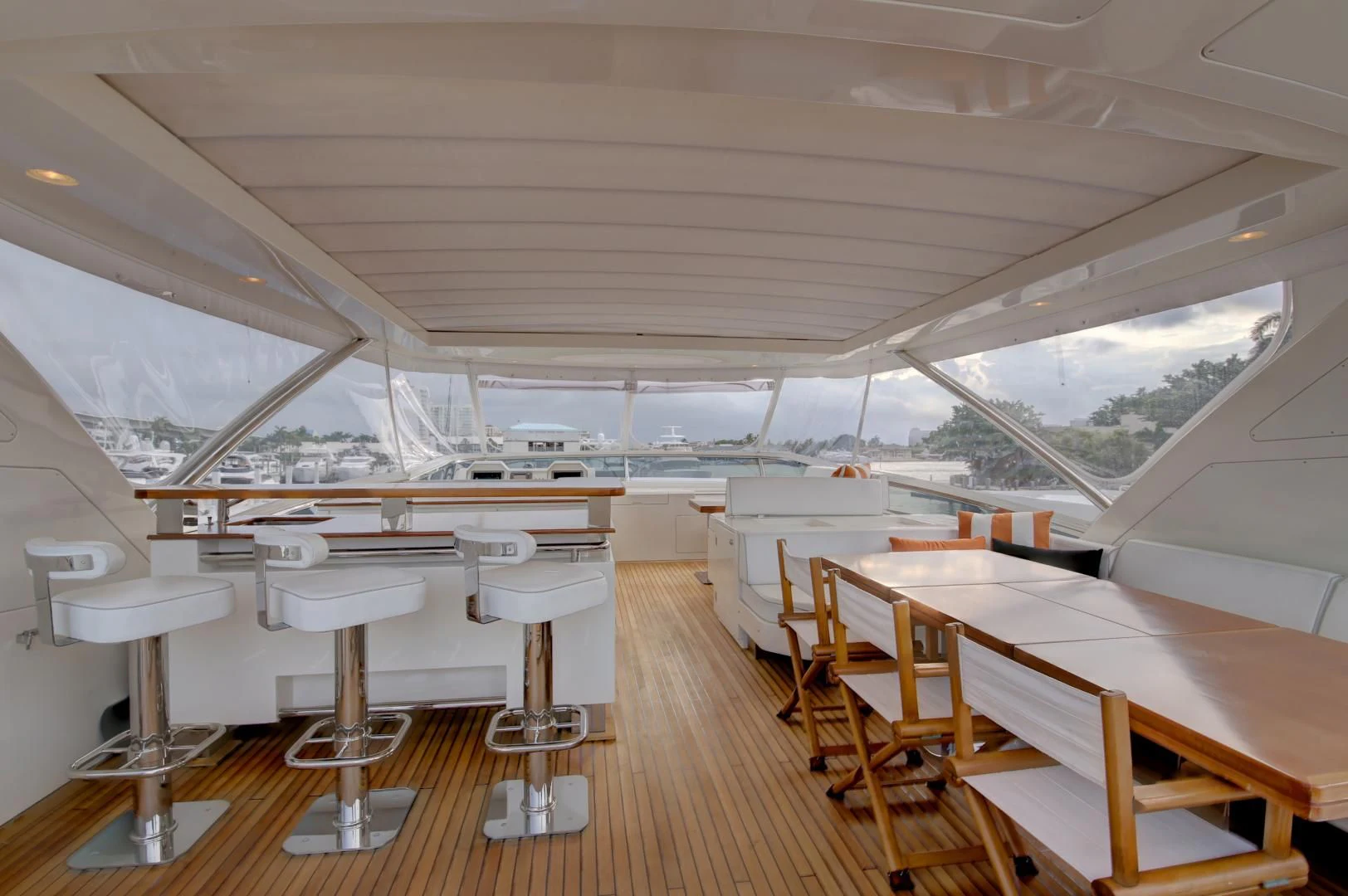 a room with tables and chairs aboard SORRIDENTE Yacht for Sale