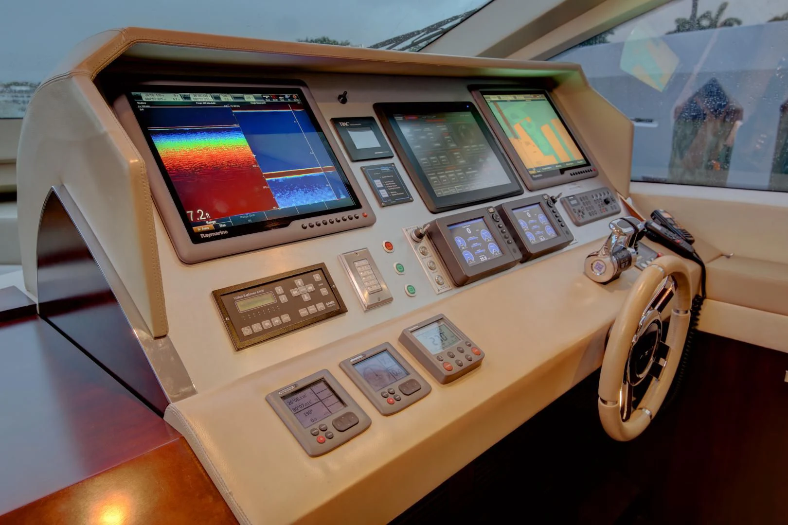 a white table with a computer and a fan on it aboard SORRIDENTE Yacht for Sale