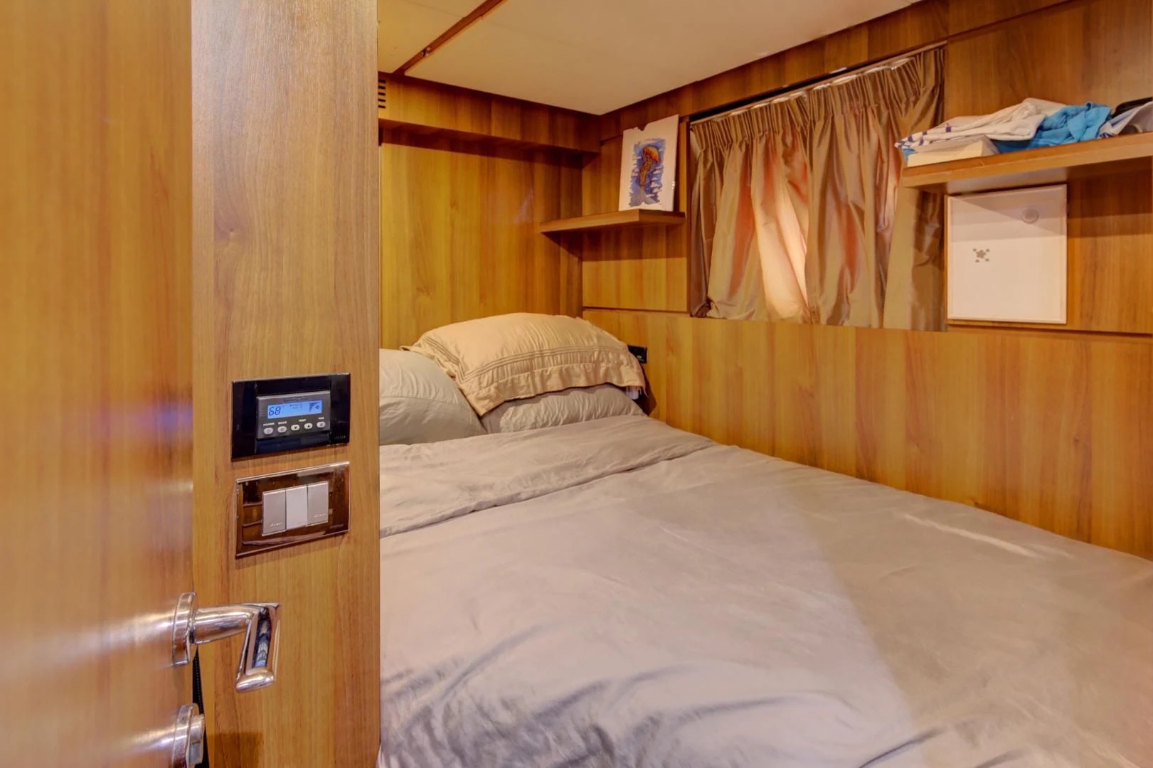 a bed with a white sheet aboard SORRIDENTE Yacht for Sale