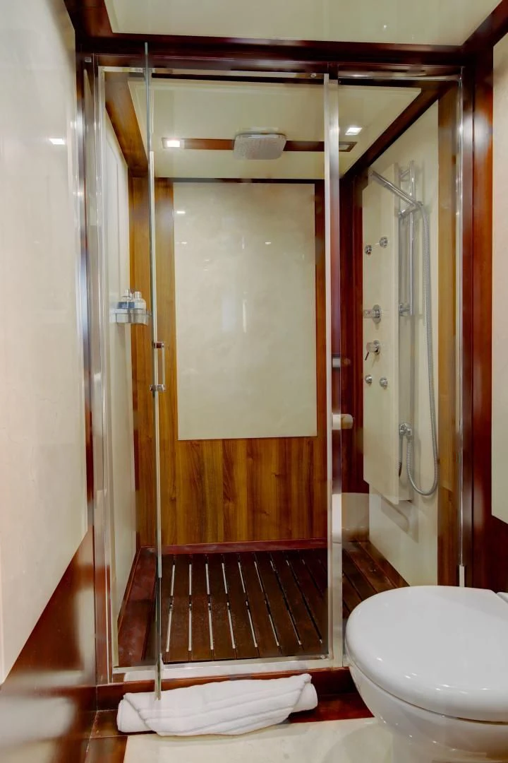 a bathroom with a glass shower aboard SORRIDENTE Yacht for Sale