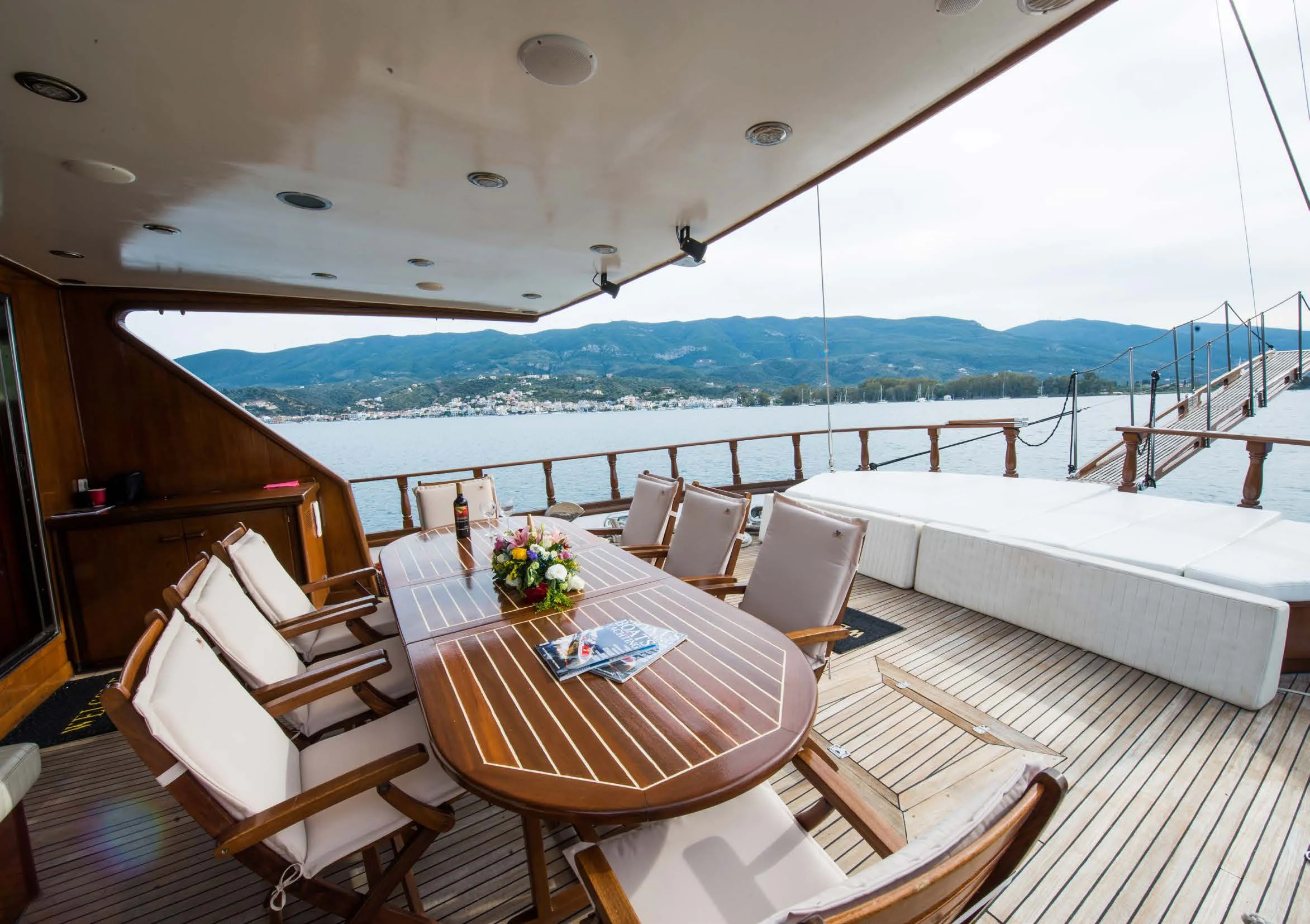 a room with a table and chairs aboard BLUE DREAM Yacht for Sale