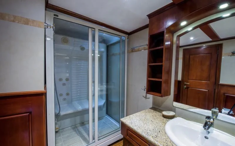 a bathroom with a glass shower aboard BLUE DREAM Yacht for Sale