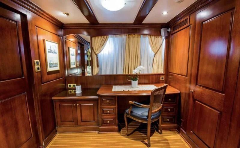 a room with a table and cabinets aboard BLUE DREAM Yacht for Sale