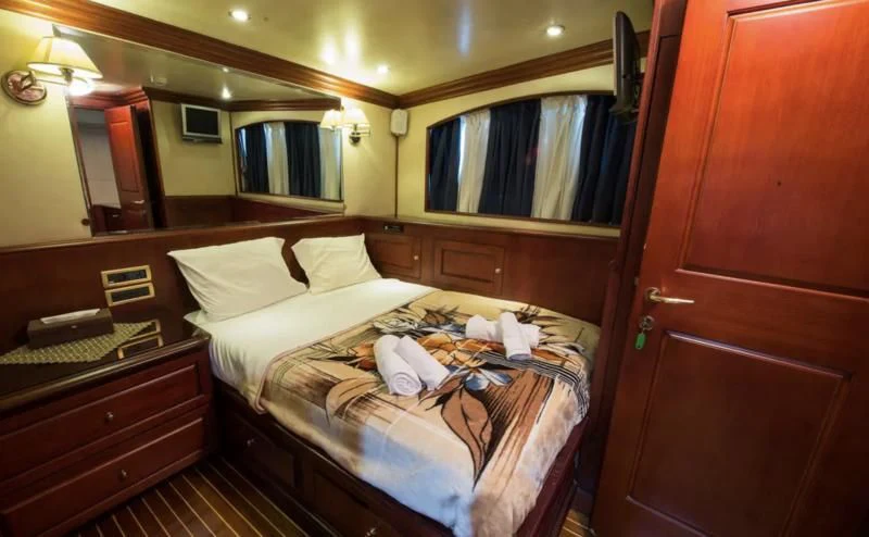 a hotel room with a bed aboard BLUE DREAM Yacht for Sale
