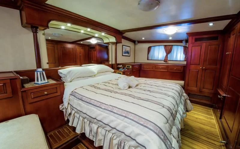 a bedroom with two beds aboard BLUE DREAM Yacht for Sale