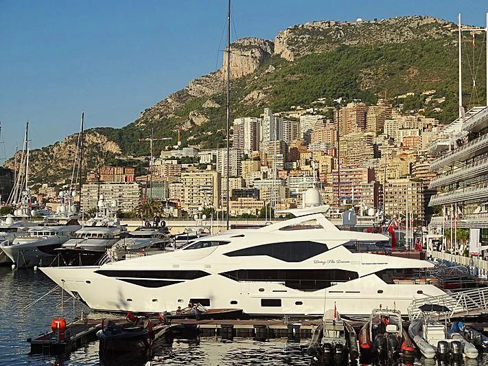 a marina with boats and buildings aboard LIVING THE DREAM Yacht for Sale