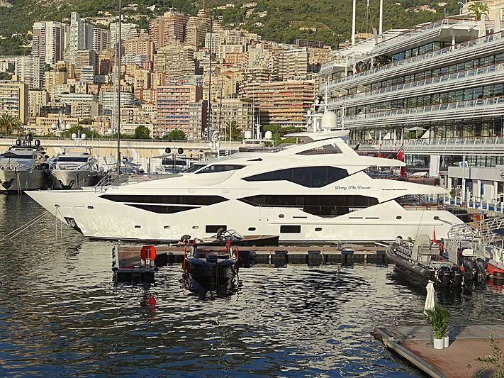 a boat docked in a harbor aboard LIVING THE DREAM Yacht for Sale