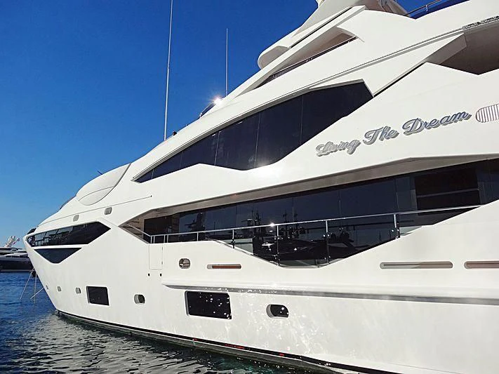 a white yacht in the water aboard LIVING THE DREAM Yacht for Sale