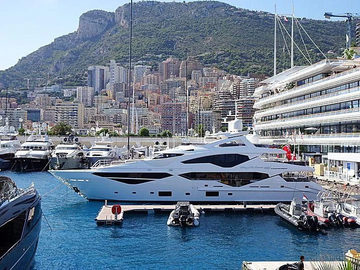 a large yacht docked at a port aboard LIVING THE DREAM Yacht for Sale