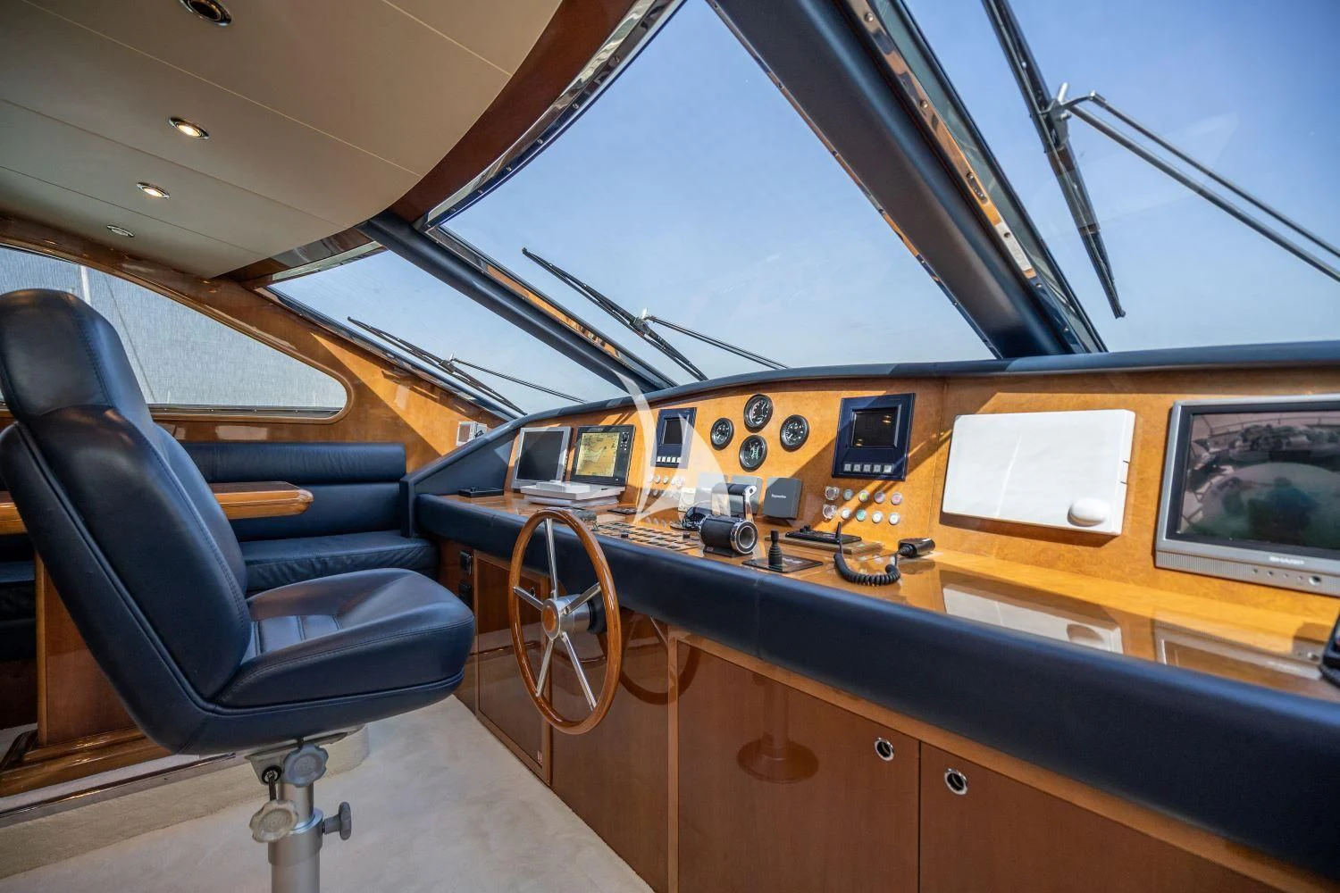 inside of a vehicle with a desk and computer aboard ESTIA POSEIDON Yacht for Charter