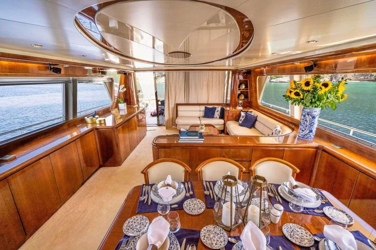 a dining room with a table set aboard ESTIA POSEIDON Yacht for Charter