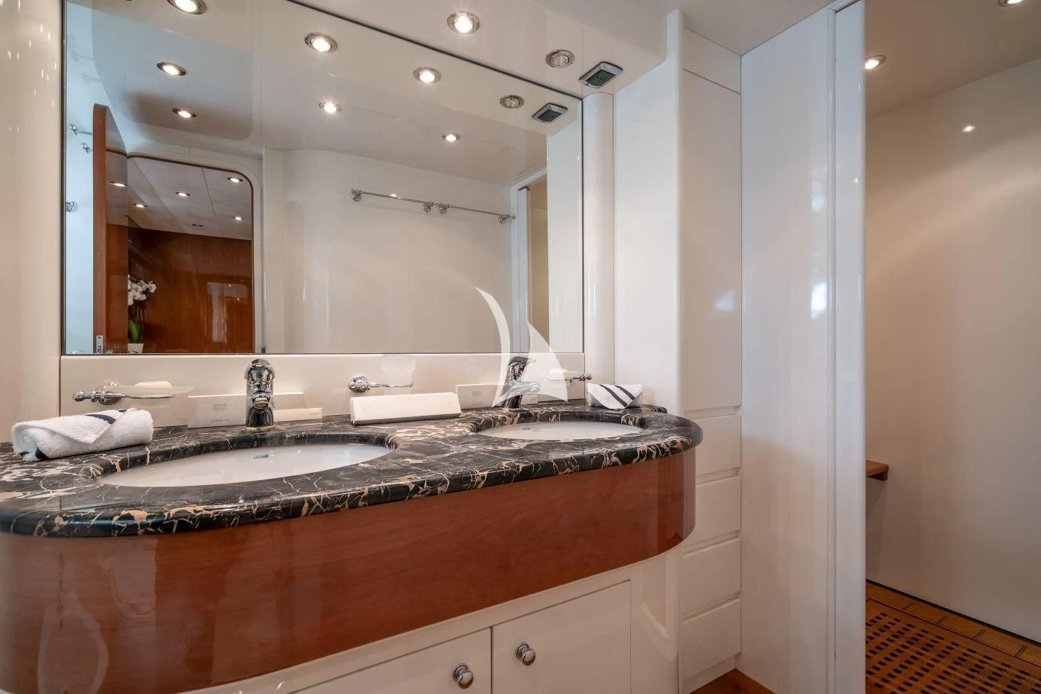 a bathroom with a large mirror aboard ESTIA POSEIDON Yacht for Charter
