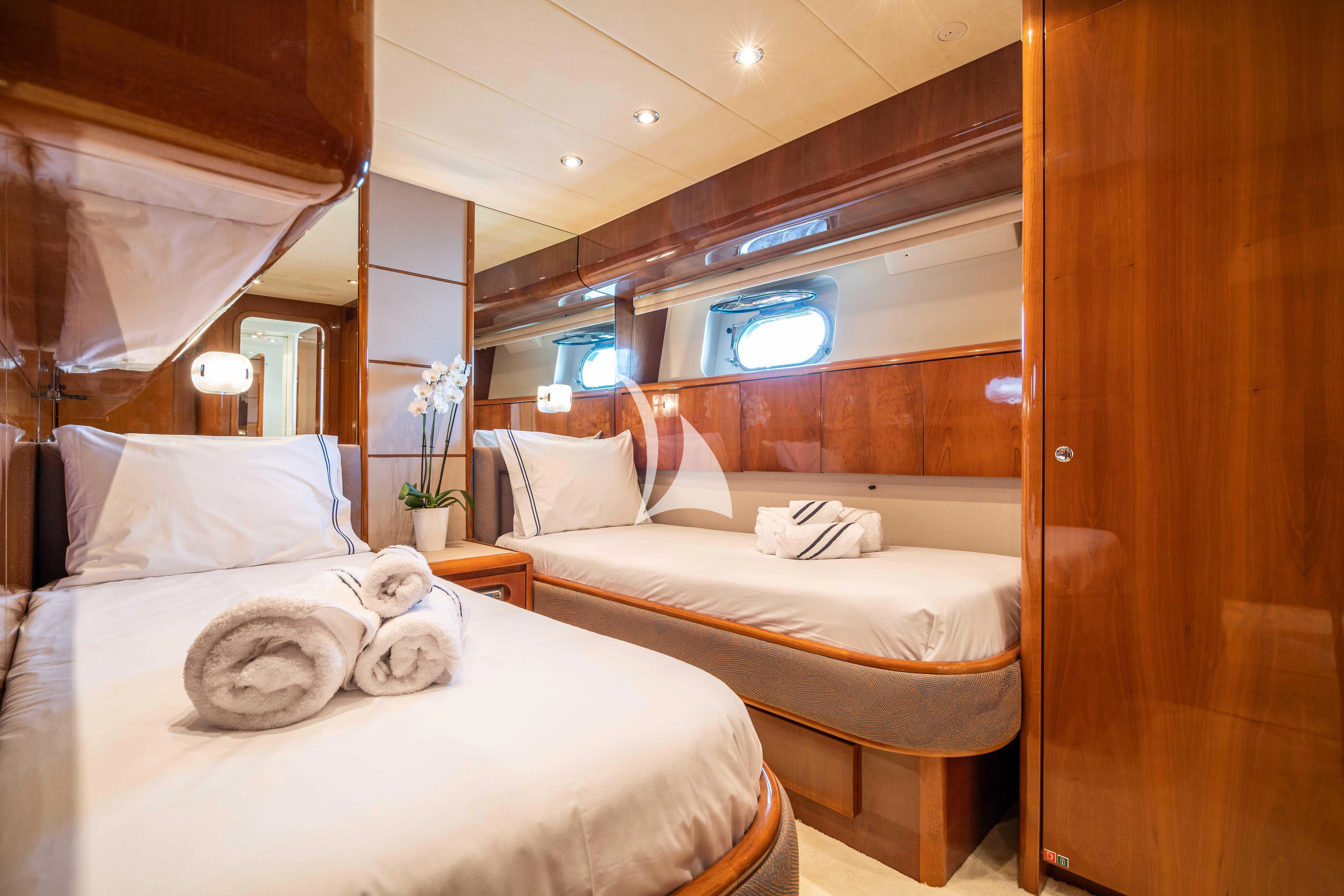 a room with two beds aboard ESTIA POSEIDON Yacht for Charter