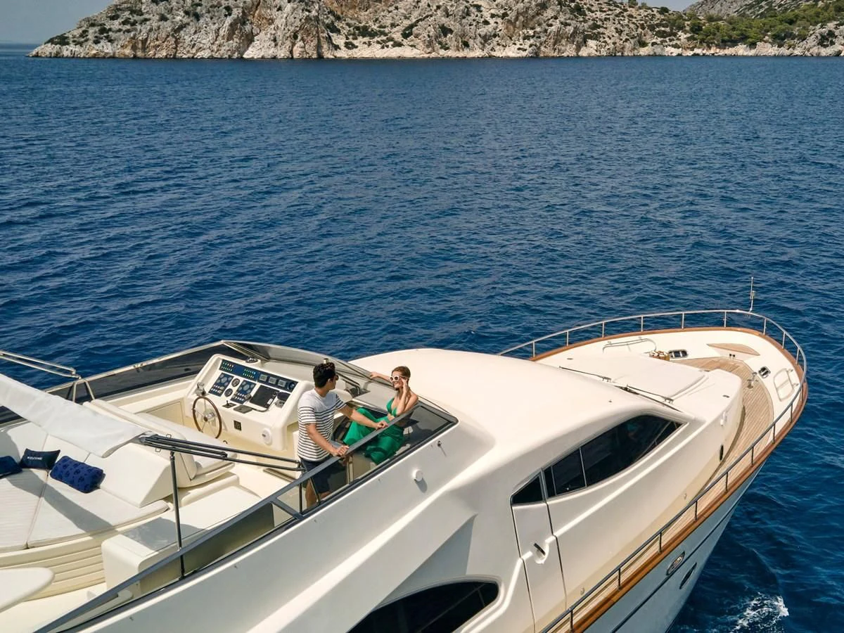 a couple of people on a boat aboard ESTIA POSEIDON Yacht for Charter