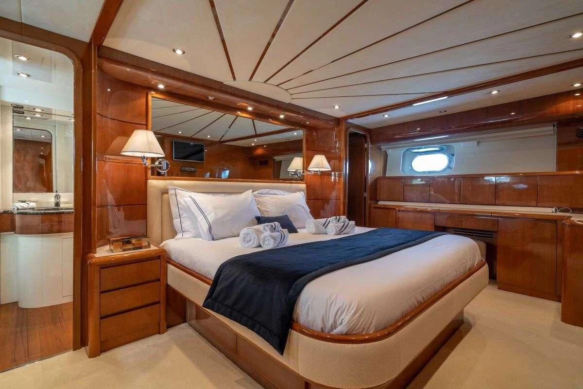 a bed in a room aboard ESTIA POSEIDON Yacht for Charter