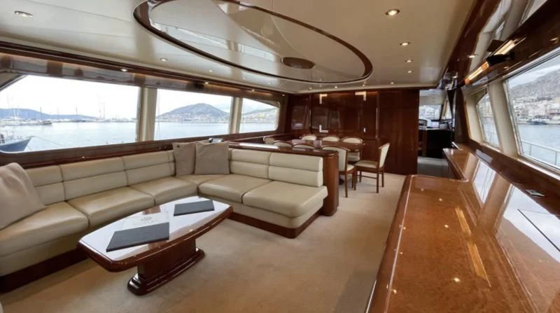 a room with a couch and a table aboard ESTIA POSEIDON Yacht for Charter