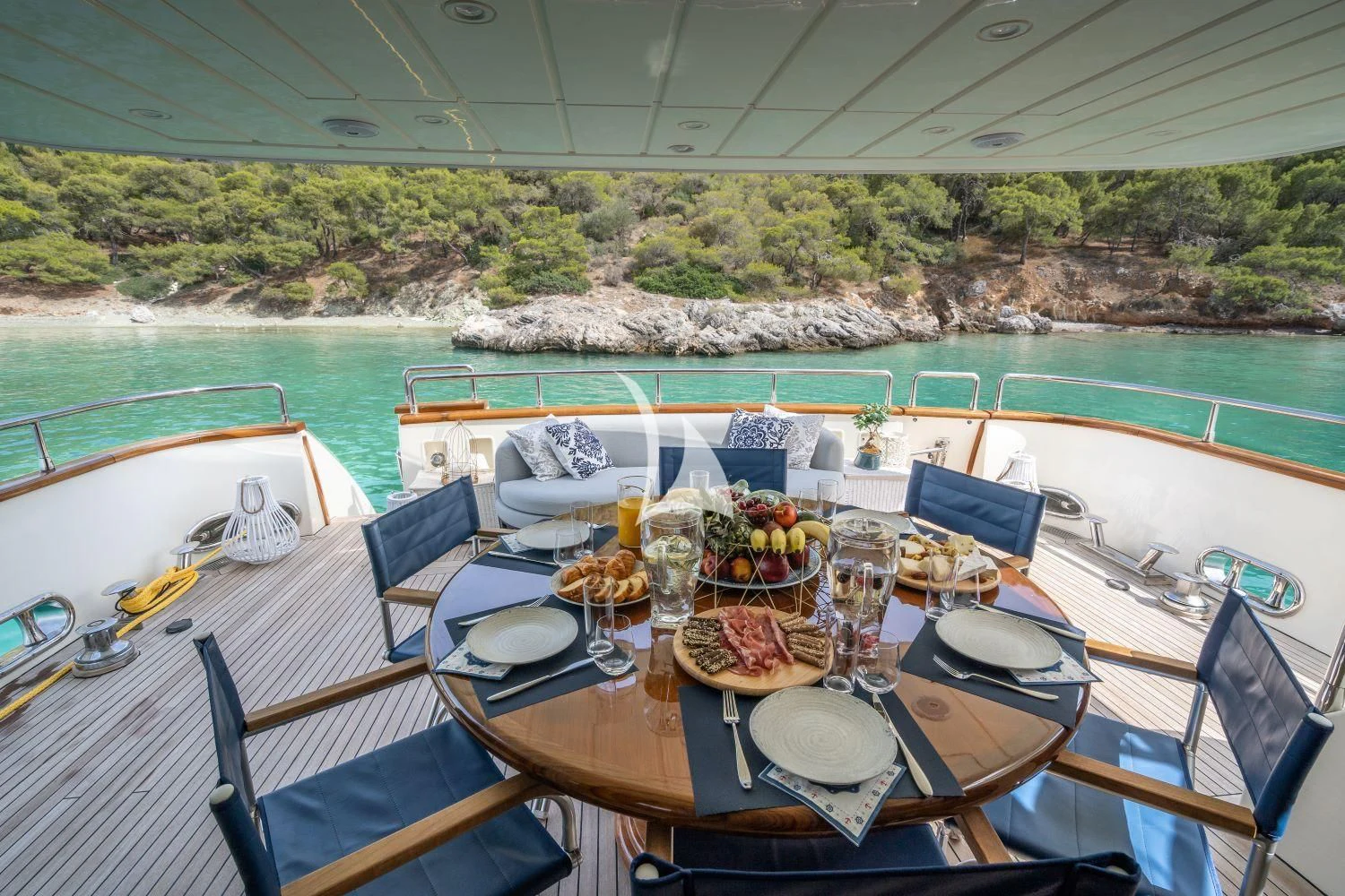 a table set for a meal on a boat aboard ESTIA POSEIDON Yacht for Charter