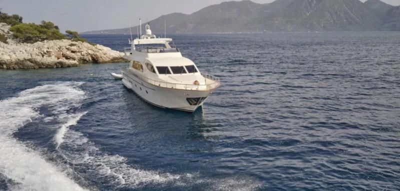a white boat on the water aboard ESTIA POSEIDON Yacht for Charter
