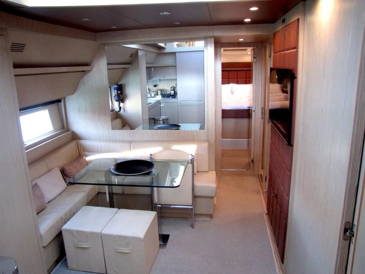 a room with a couch and a table aboard UNNAMED Yacht for Sale