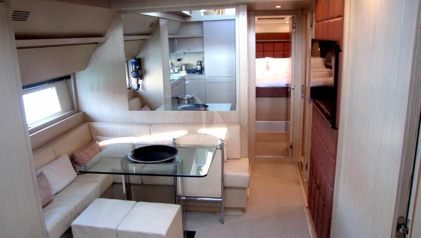 a room with a table and chairs aboard UNNAMED Yacht for Sale