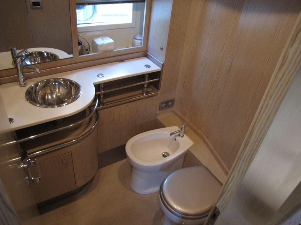 a bathroom with a toilet and sink aboard UNNAMED Yacht for Sale