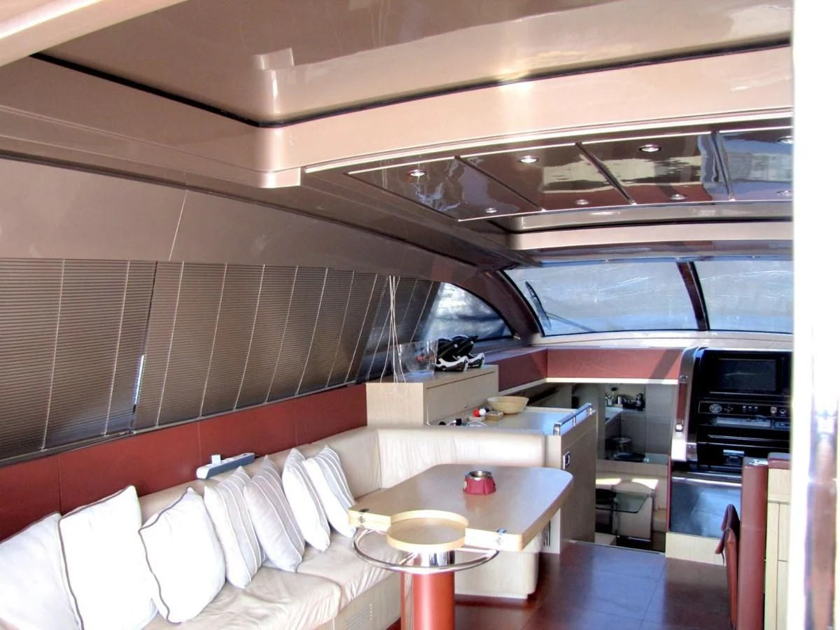 a room with a bed and a table aboard UNNAMED Yacht for Sale