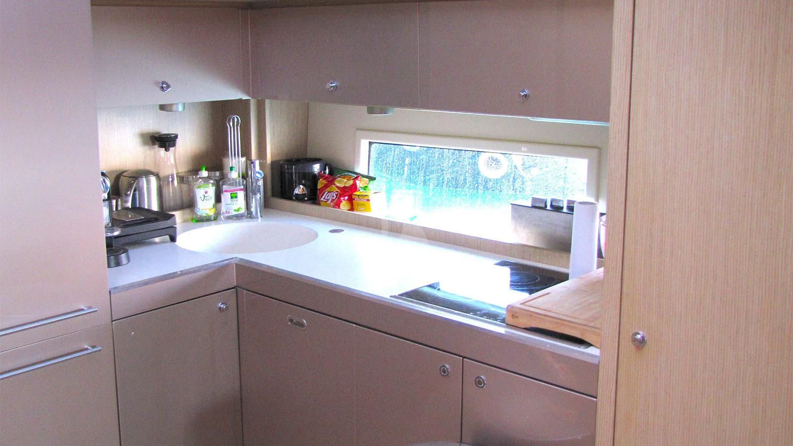 a kitchen with a sink and cabinets aboard UNNAMED Yacht for Sale