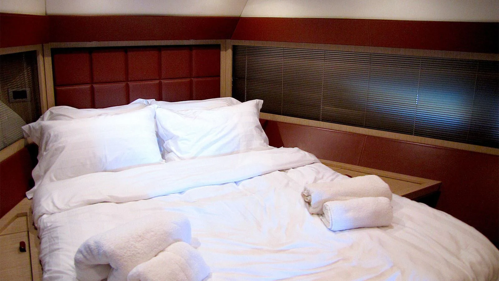 a bed with white sheets aboard UNNAMED Yacht for Sale