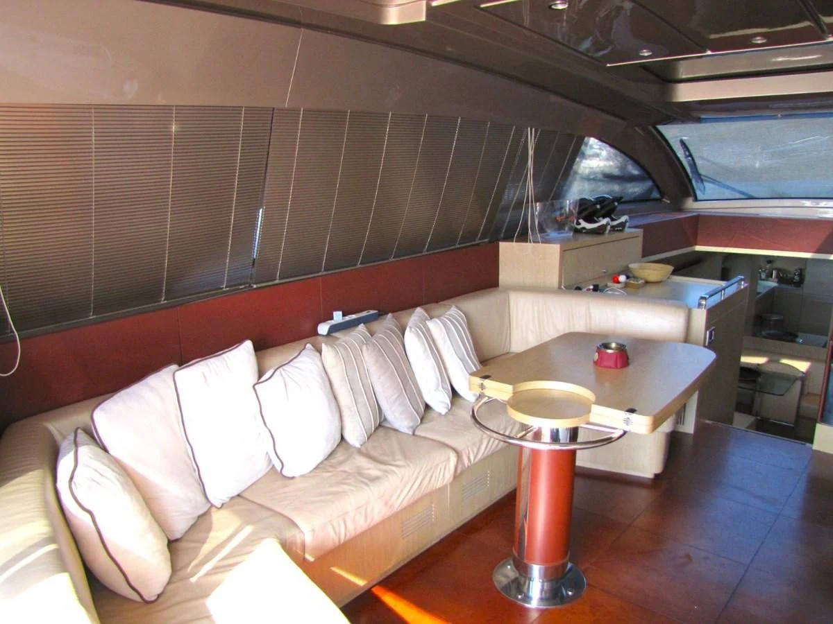 a room with a couch and a table aboard UNNAMED Yacht for Sale