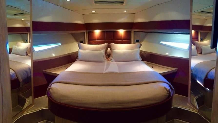 a room with a bed and a window aboard UNNAMED Yacht for Sale
