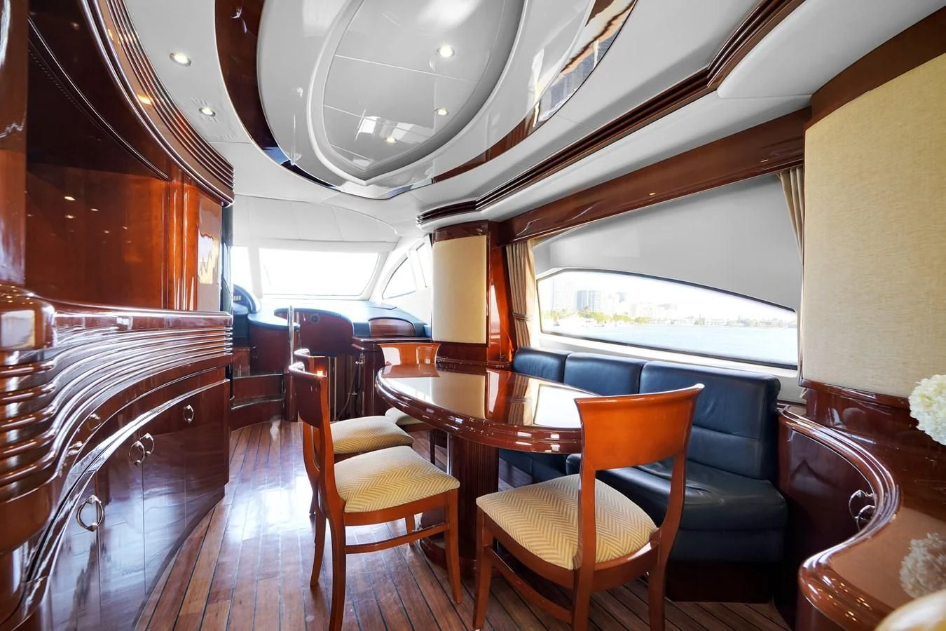 a room with wooden furniture aboard AZIMUT 80 2003 Yacht for Sale