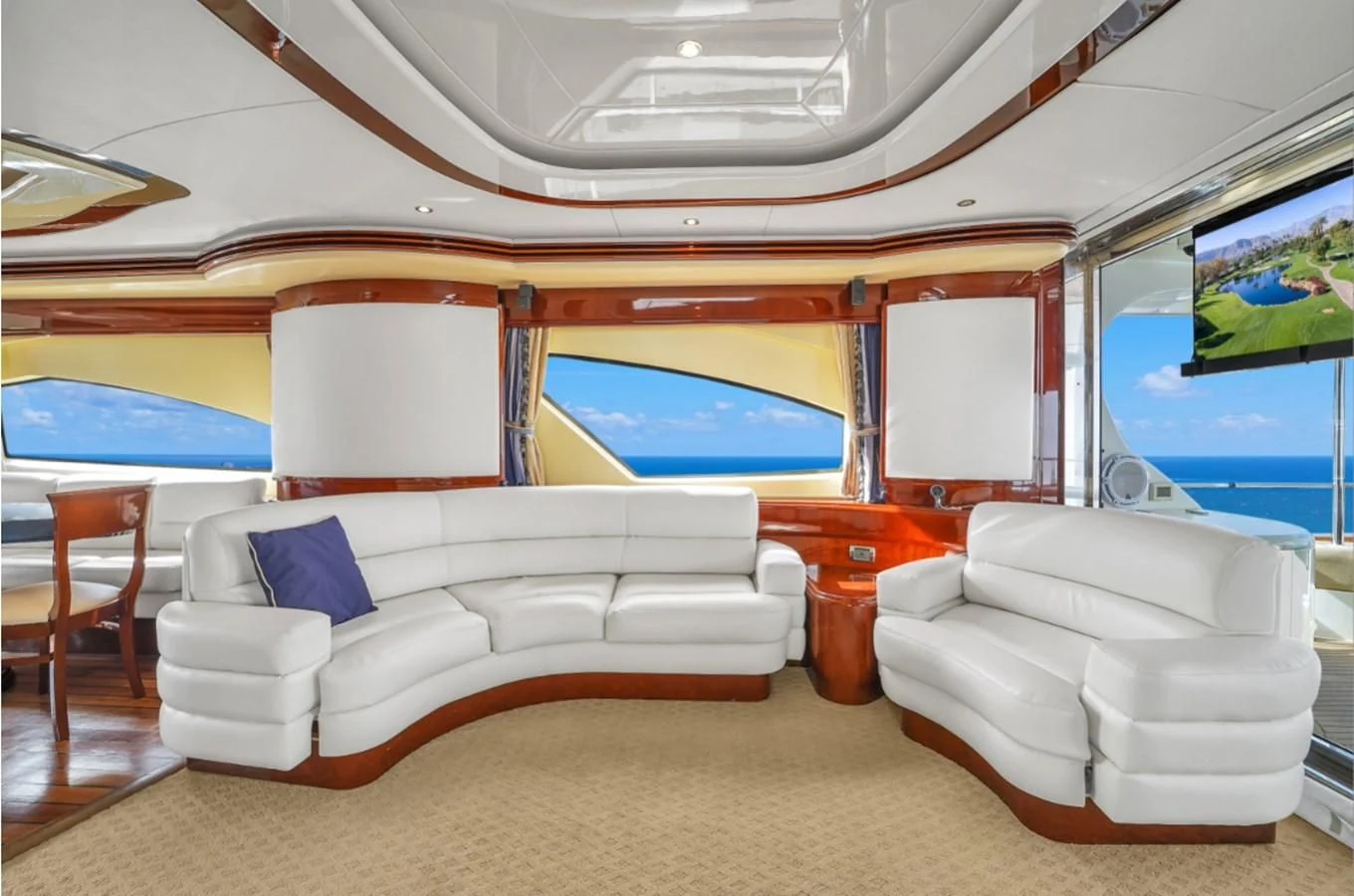 a room with a couch and a television aboard AZIMUT 80 2003 Yacht for Sale