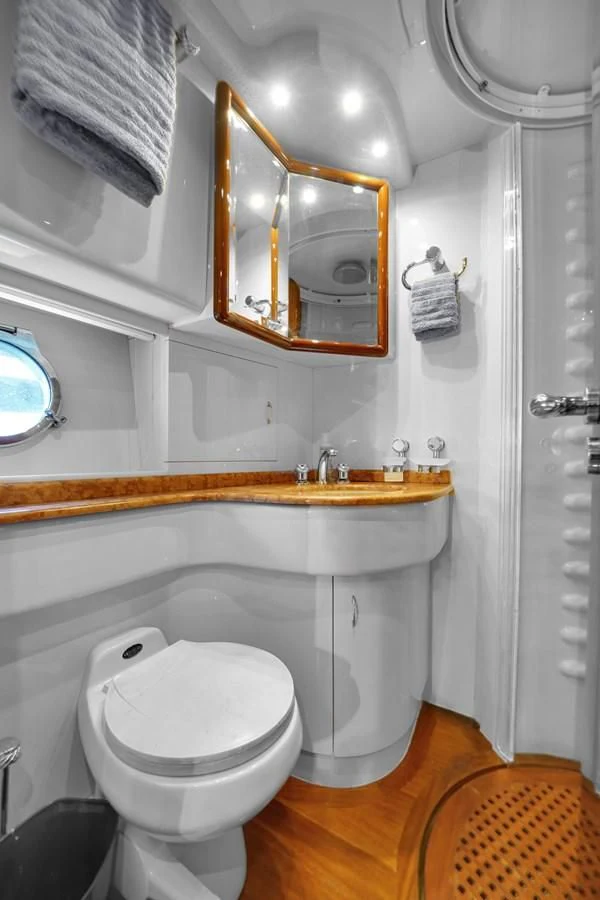 a bathroom with a toilet and a sink aboard AZIMUT 80 2003 Yacht for Sale