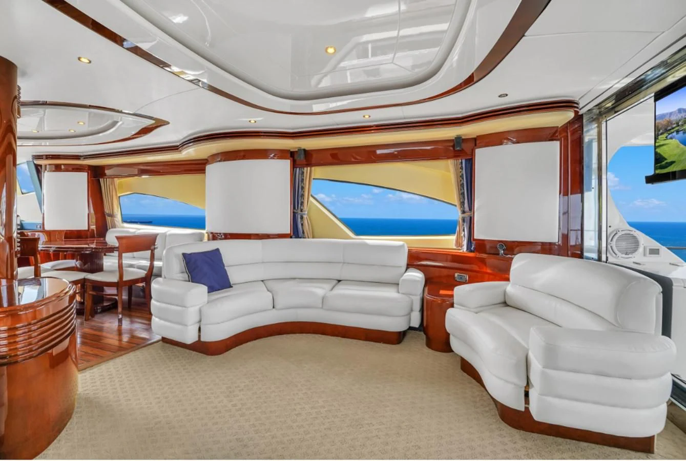 a room with a couch and a pool table aboard AZIMUT 80 2003 Yacht for Sale