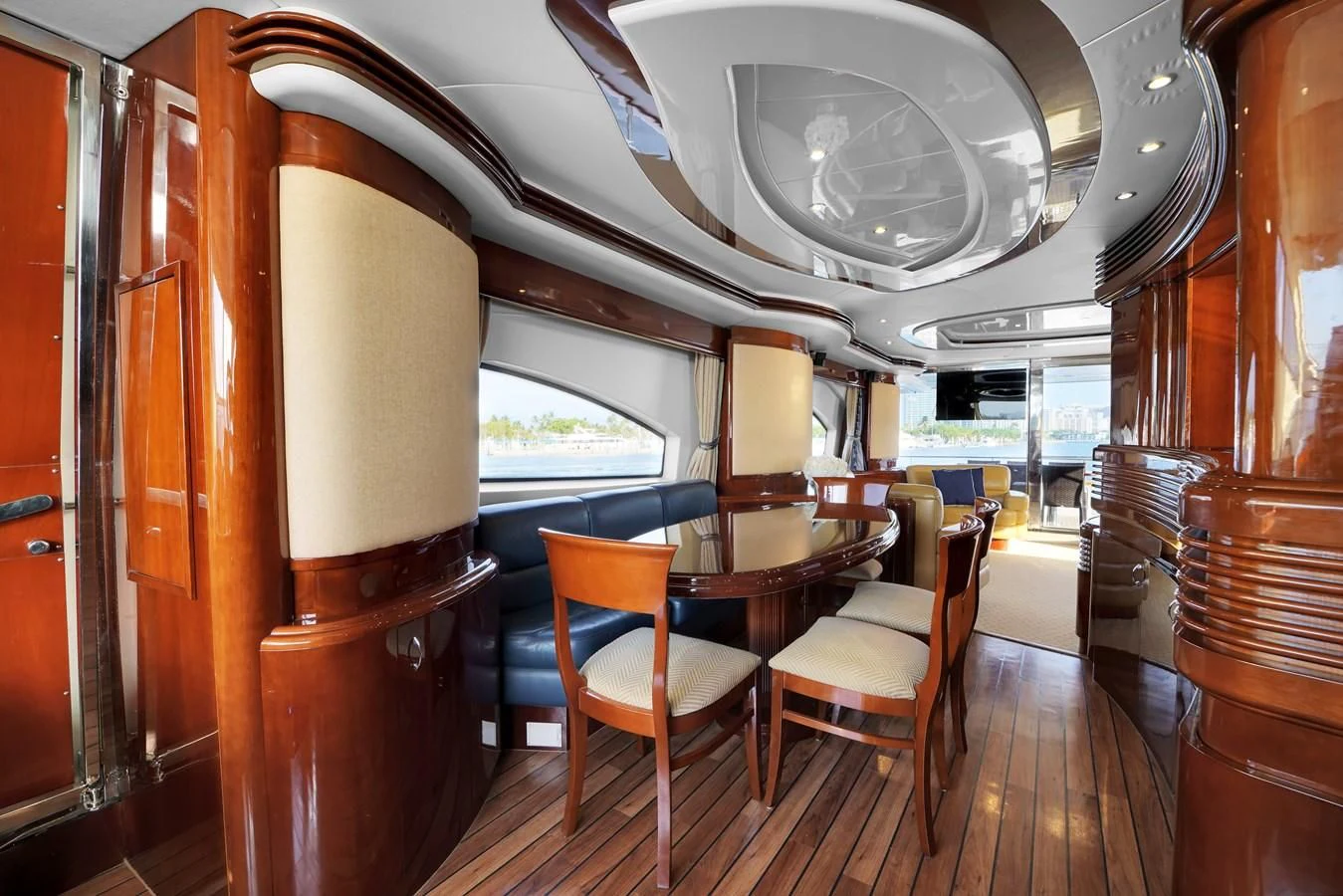 a room with a table and chairs aboard AZIMUT 80 2003 Yacht for Sale