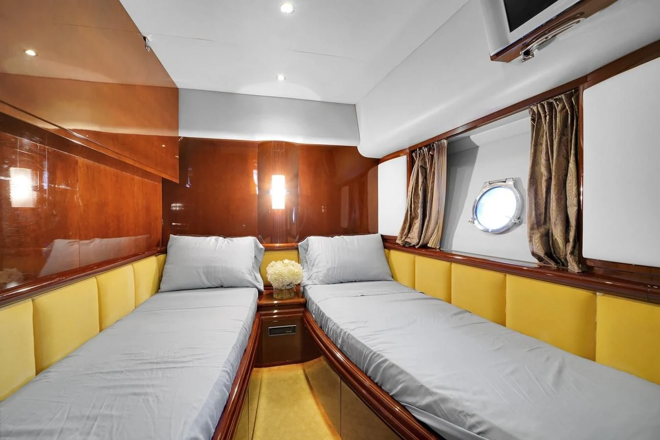 a room with a couple of beds aboard AZIMUT 80 2003 Yacht for Sale