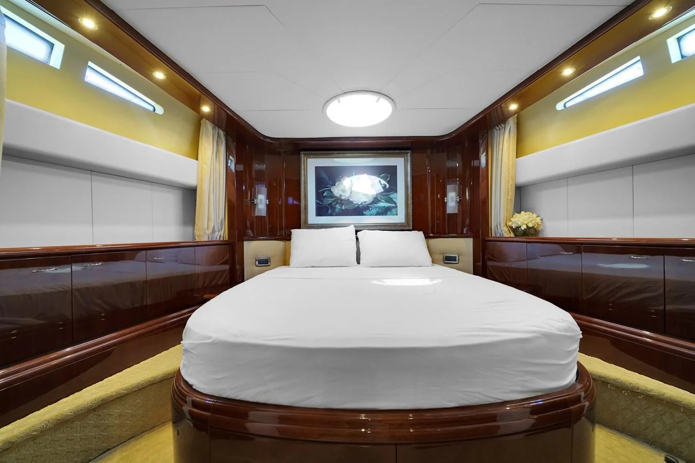 a bed in a room aboard AZIMUT 80 2003 Yacht for Sale