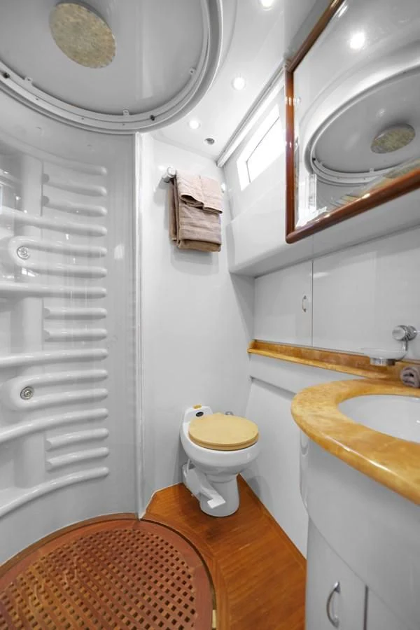 a bathroom with a toilet and sink aboard AZIMUT 80 2003 Yacht for Sale