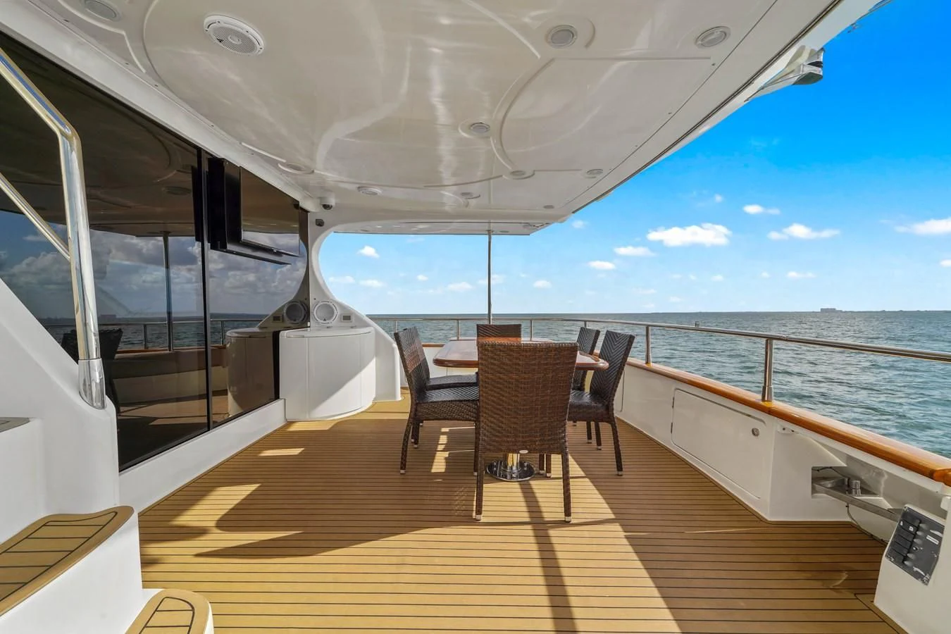 a deck with chairs and tables on it on a boat aboard AZIMUT 80 2003 Yacht for Sale