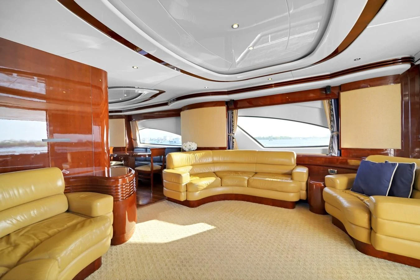 a room with couches and a window aboard AZIMUT 80 2003 Yacht for Sale