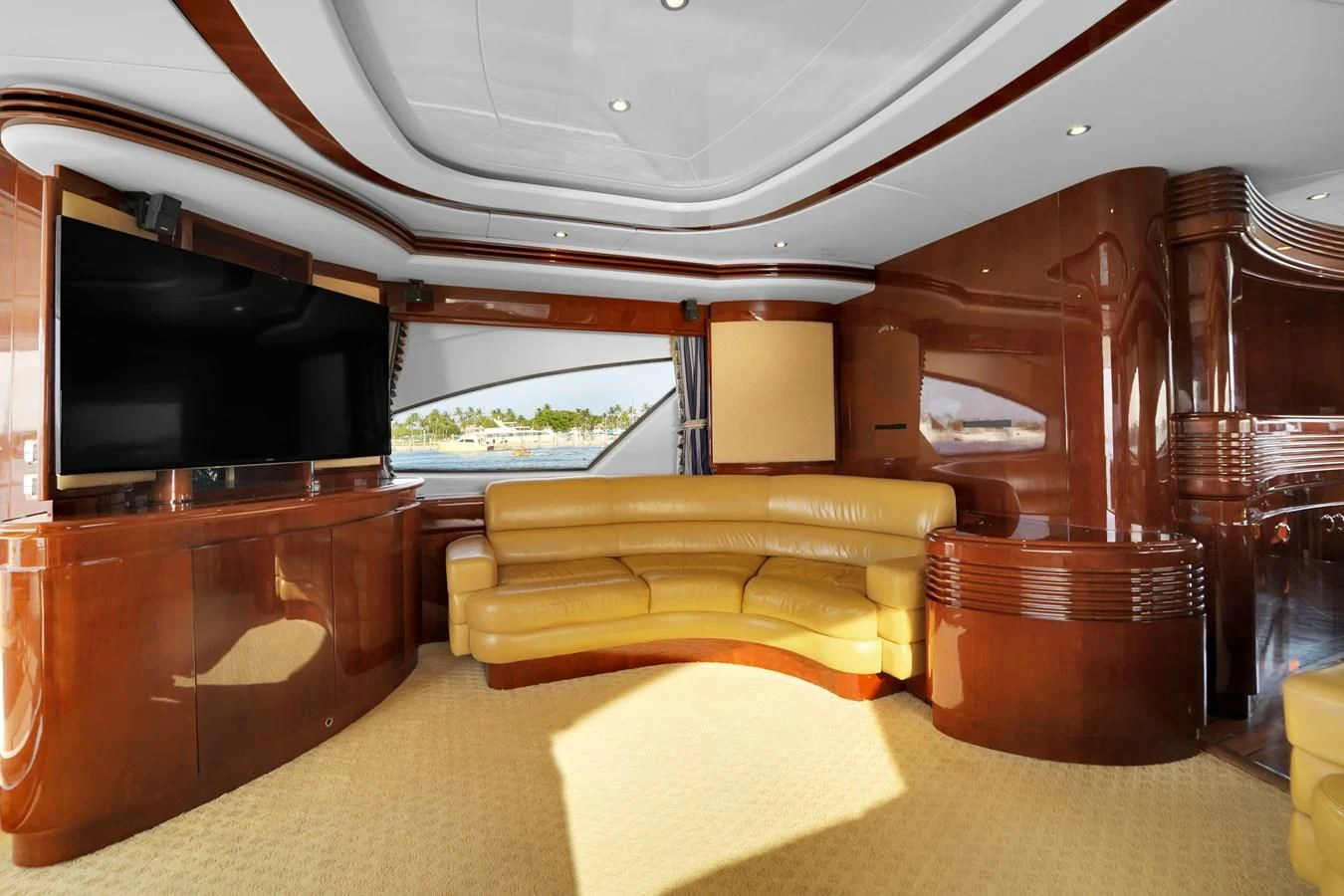 a living room with a couch and a tv aboard AZIMUT 80 2003 Yacht for Sale