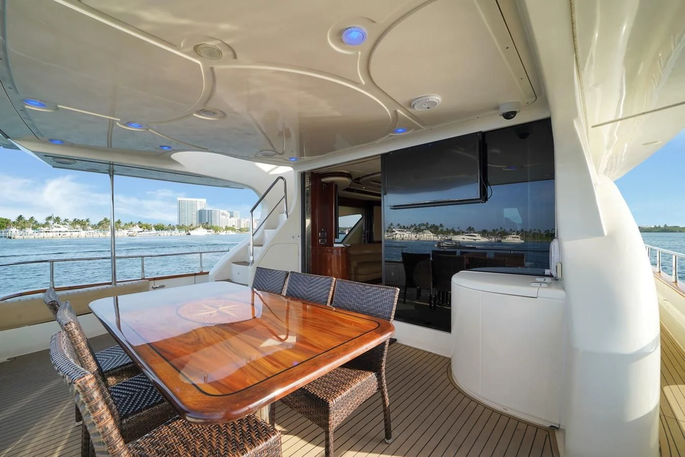 a table and chairs on a boat aboard AZIMUT 80 2003 Yacht for Sale