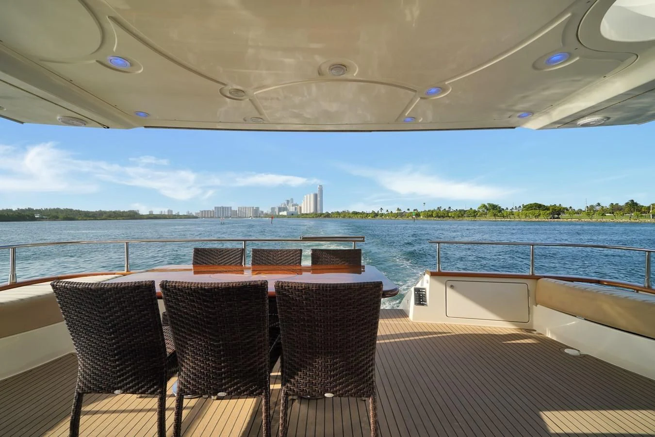 a group of chairs on a deck overlooking a body of water aboard AZIMUT 80 2003 Yacht for Sale