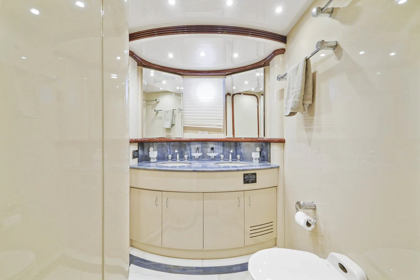 a bathroom with a sink and a mirror aboard AZIMUT 80 2003 Yacht for Sale